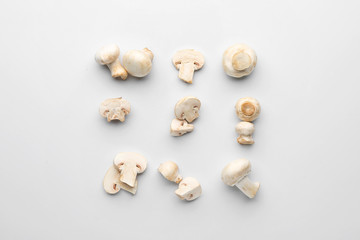 Fototapeta na wymiar Fresh champignon mushrooms on white background