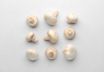 Fresh champignon mushrooms on white background