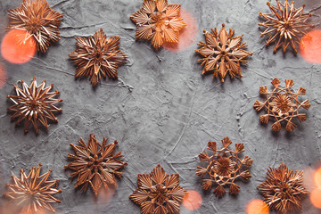 New Year's straw toys, on a gray concrete background. Christmas card