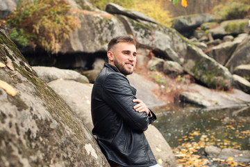 Handsome young man outdoors on autumn day