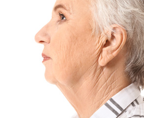 Fototapeta premium Senior woman with hearing problem on white background