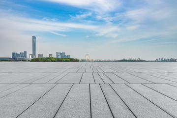 Panoramic skyline and buildings with empty concrete square floor