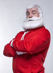 Portrait of a Santa Claus in sportsware with hands crossed