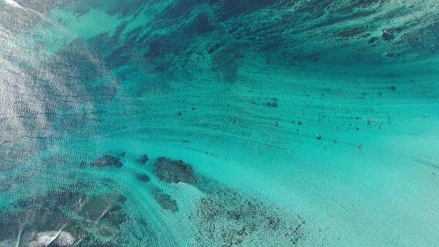 Le Morne underwater waterfall at Mauritius with turquoise sea water aerial shot