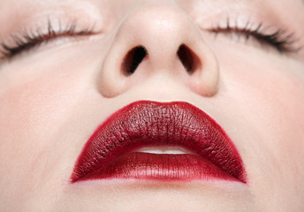 Closeup macro portrait of female face with red lips and beauty makeup. - obrazy, fototapety, plakaty