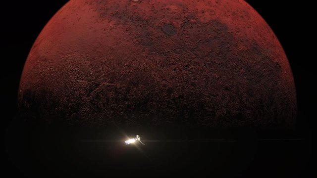 Red planet Mars slowly turning in space concept with a probe or satellite moving across the planet