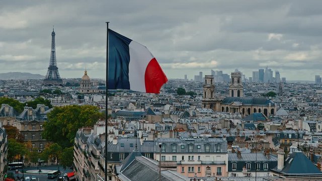 Aerial view of Paris on a moody day. From left to right is the Eiffel Tower, Les Invalides, Eglise Saint-Sulpice and in the background La Defense