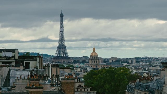 Aerial view of Paris, France on a cloudy day. From left to right is the Eiffel Tower and Les Invalides