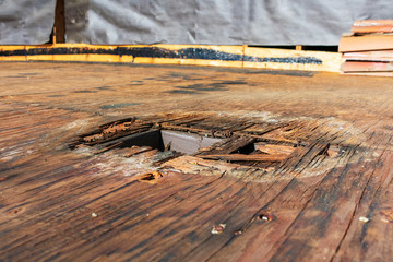 Plywood decking damage and water stains from rain water