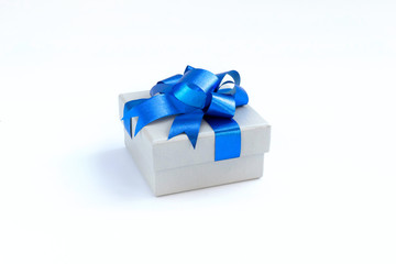 box with blue ribbon and bow isolated on white
