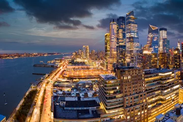 Foto op Plexiglas Aerial panorama of New York City skyscrapers at dusk as seen from above the 12th avenue and 26th street, close to Hudson Yards and Chelsea neighborhood © mandritoiu