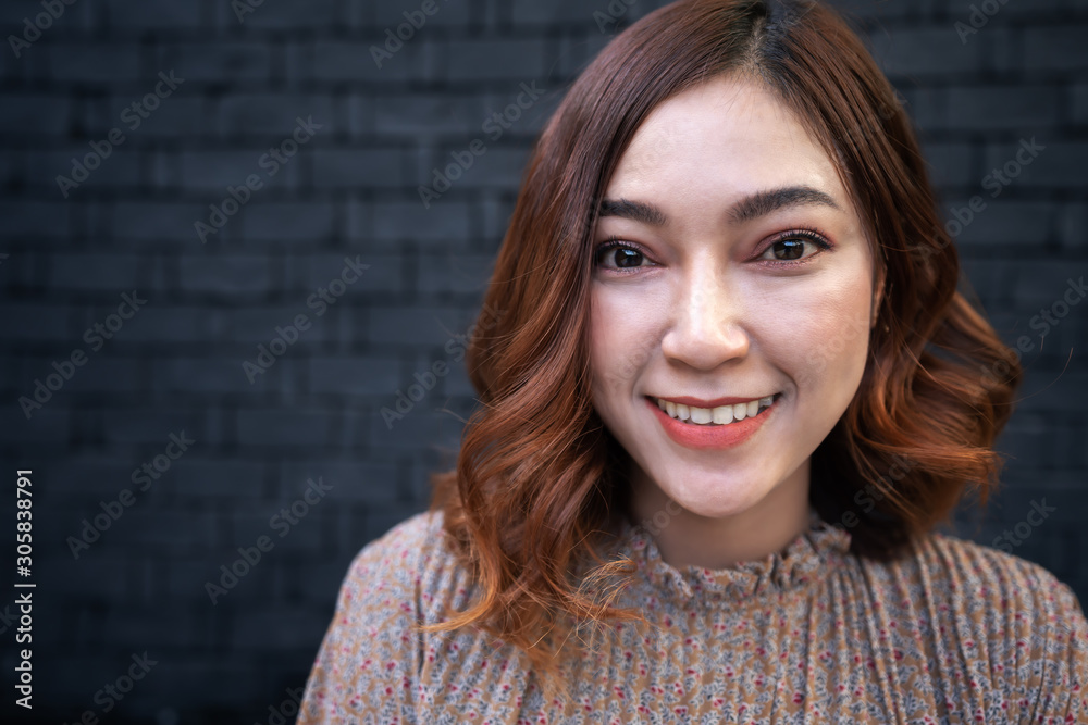 Wall mural close up portrait of young asian woman smiling