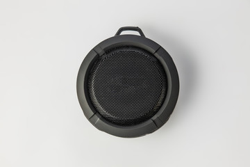 Round Bluetooth speaker on white background isolate