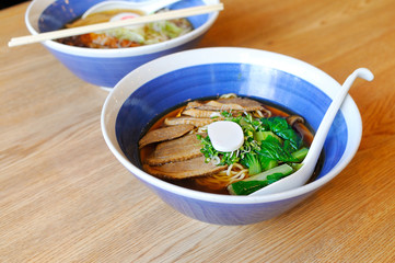 Korean style bowl of noodles placed on a wooden table