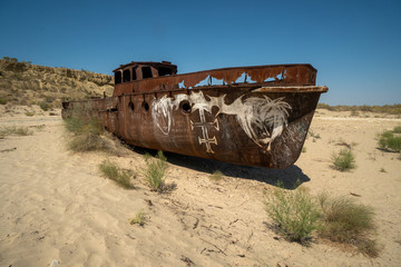 Rusty ship wreck in the deserted Aral Sea near Muynak en Uzbekistan