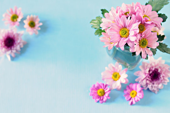 Bouquet of bright colors on the blue background with copy space/ selective focus