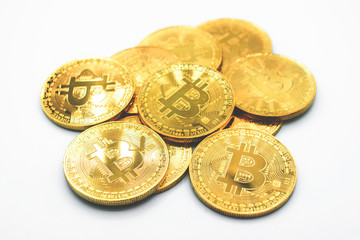 Stack of golden Bitcoin isolated on white background. Bitcoin is one of the popular cryptocurrency (a digital assets) , it's the innovative payment network and a new kind of money. 