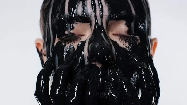 Face Sweet Lady Crazy Blonde Violence Mask Mud Closeup Looking At Camera With Cosmetic White Background 4K. Cute Girl Expressive Destroy Mask Face. Crazy Woman Not Feeling Mind Pain With Stress Eyes.