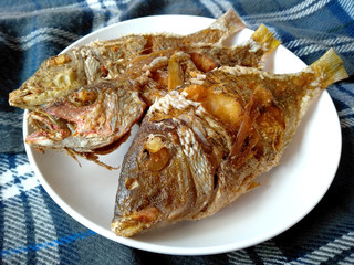 Traditional indonesian culinary food. Ikan Goreng or fried fish. Ikan Goreng Indonesian Food that is simple and often made at home. Indonesian Street Food.
