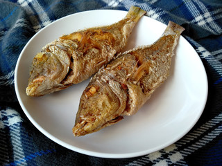 Traditional indonesian culinary food. Ikan Goreng or fried fish. Ikan Goreng Indonesian Food that is simple and often made at home. Indonesian Street Food.