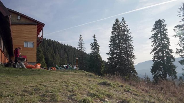 People enjoying sun on the Postavarul SKV Chalet in Poiana Brasov, Romania.