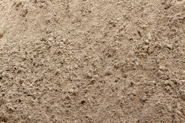 Construction river sand closeup as a background.