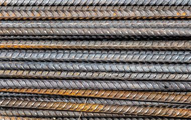 Pile of construction metal reinforcement at a construction site close-up.