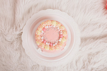 cake on white background closeup. Confectionery decorated with roses. The concept of advertising baking, calorie, food, diet
