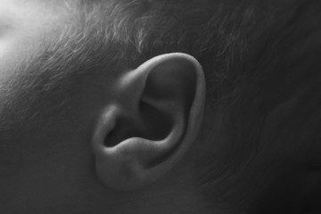 newborn baby's ear close upconcept of childhood, health care, IVF, hygiene