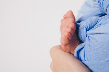 Newborn Baby's feet. legs massage concept of childhood, health care, IVF, hygiene