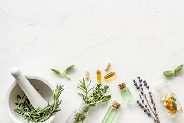 Apothecary of natural wellness and self-care. Herbs and medicine on white background top view frame...