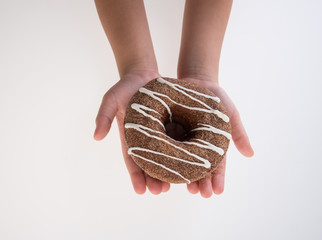 Donut or Donuts with hand on a background new.