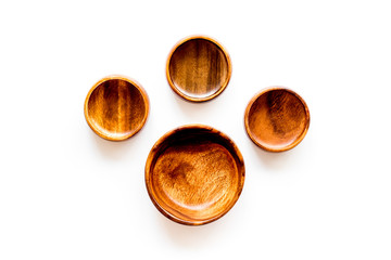Making wooden dishes. Empty bowls on white background top view copy space
