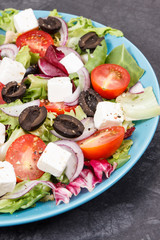 Greek salad with feta cheese and vegetables. Healthy meal as source vitamins