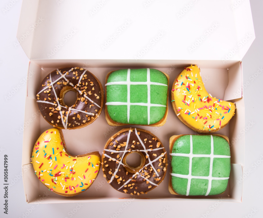 Wall mural donut or box of doughnuts on a background new.