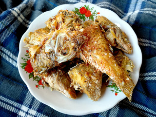Traditional indonesian culinary food. Ikan Goreng or fried fish. Ikan Goreng Indonesian Food that is simple and often made at home. Indonesian Street Food.