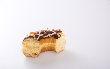 donut or donut with missing bite on a background new.