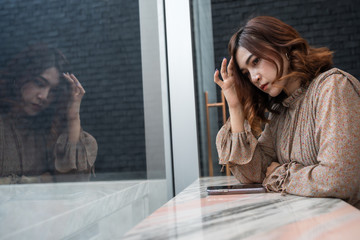 depressed woman having headache, feeling sad, worry about problem