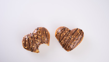 donut or donut with missing bite on a background new.