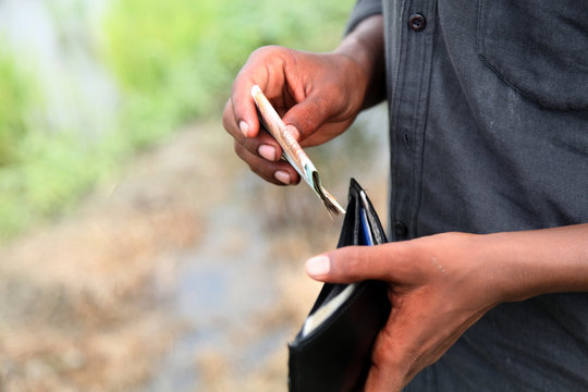 Human hand holding money in hands