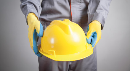 Worker with a yellow helmet.