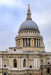 Fototapeta na wymiar View of the dome of the famous St. Paul's Cathedral in city center on a cloudy day in London, England