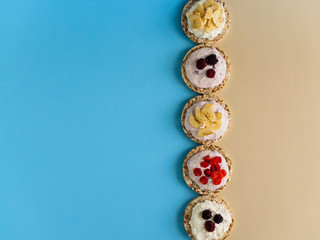 Dessert of Crispbread, cottage cheese and fruit on a colored background. Copy space