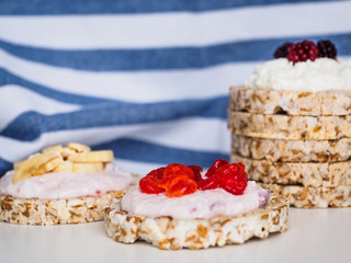 Crispbreads stacked pyramid and fruit on kitchen towel background