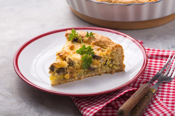 Slice of Pot pie. Individual open chicken mushroom tart  with puff pastry crust. top view