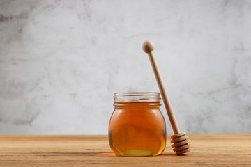 honey in a jar with dipper