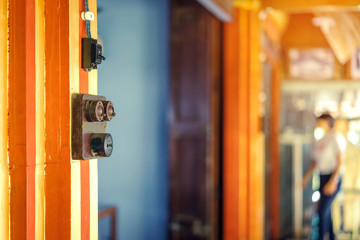 Close up to a very old light electric retro switch on on a wooden board. Vintage switch, Selective focus