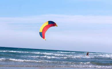 Seascape with kite against sky as background