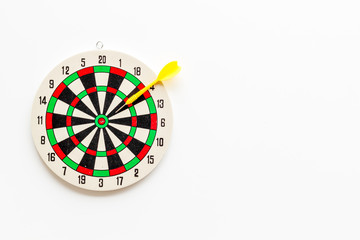 Goal achievement concept. Dartboard and arrows or dart on white background top view copy space