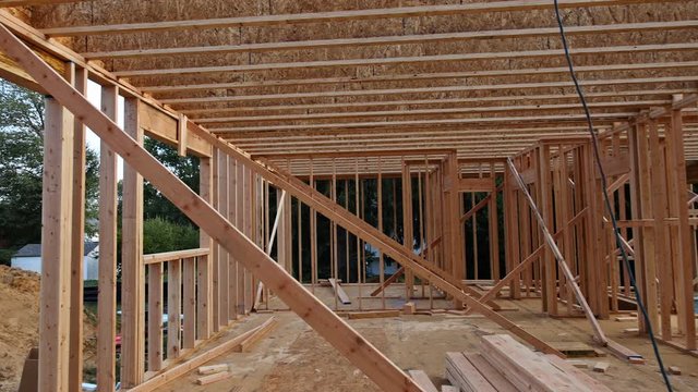 Interior of a new home wooden beams at construction residential construction house framing